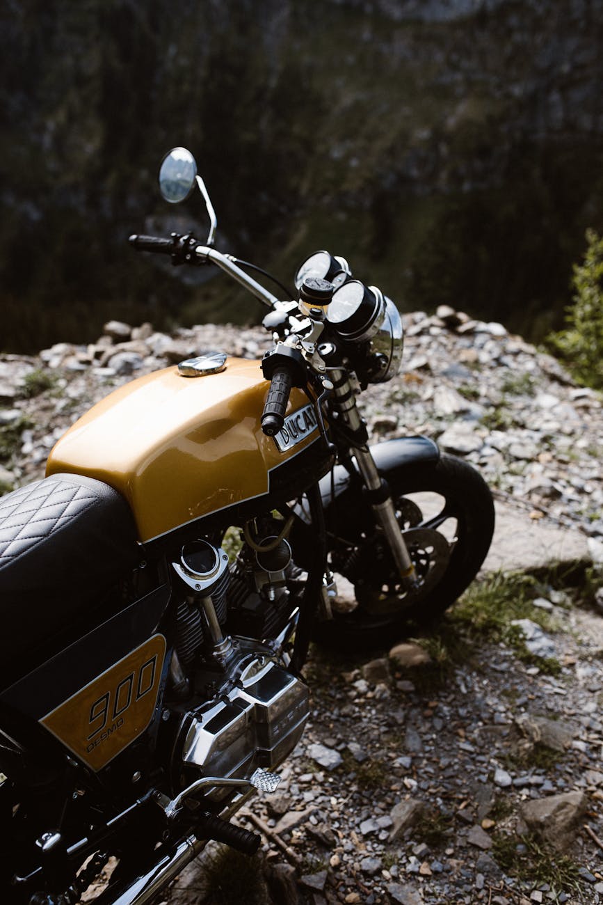 yellow and black motorcycle on dirt ground