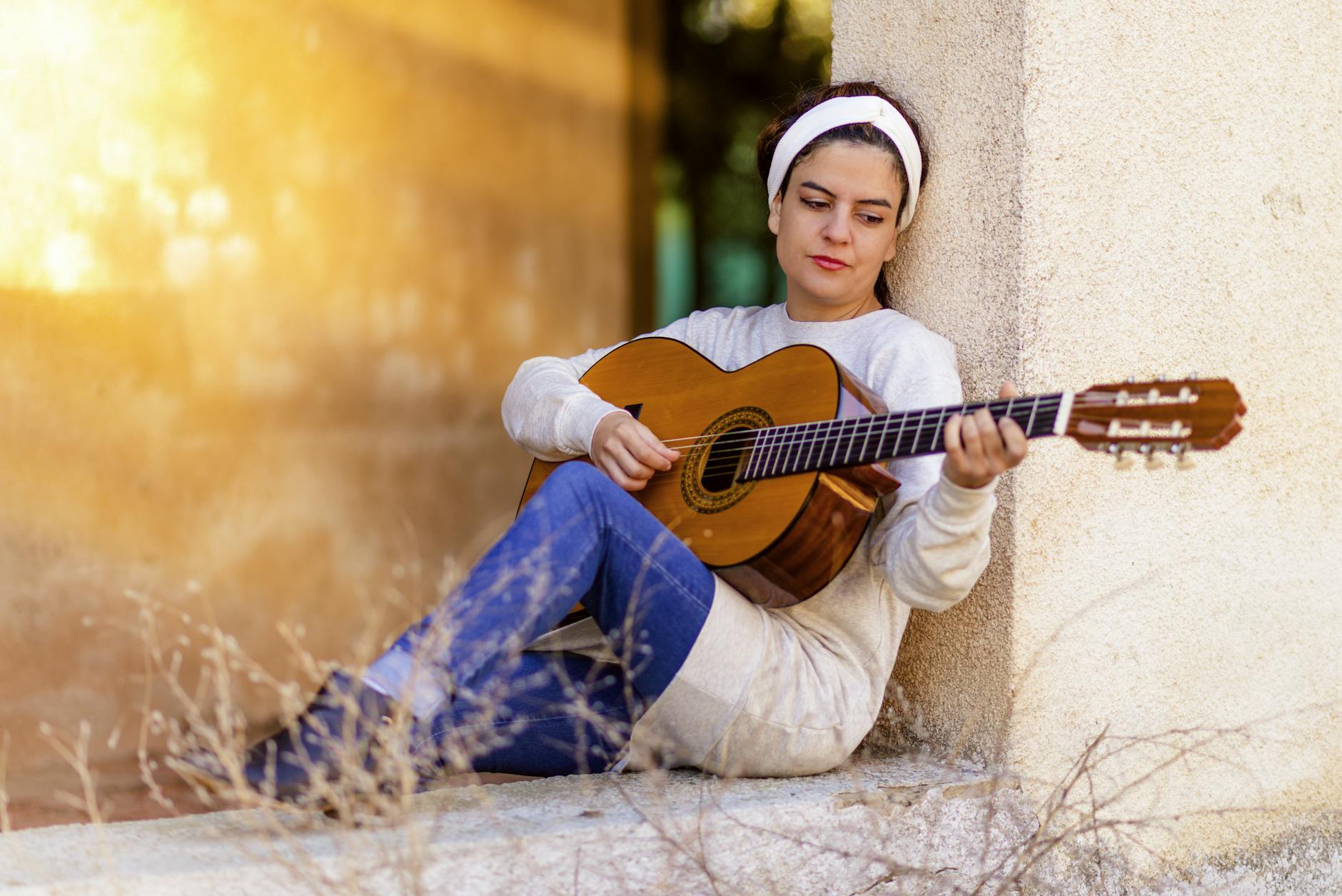 woman playing guitar