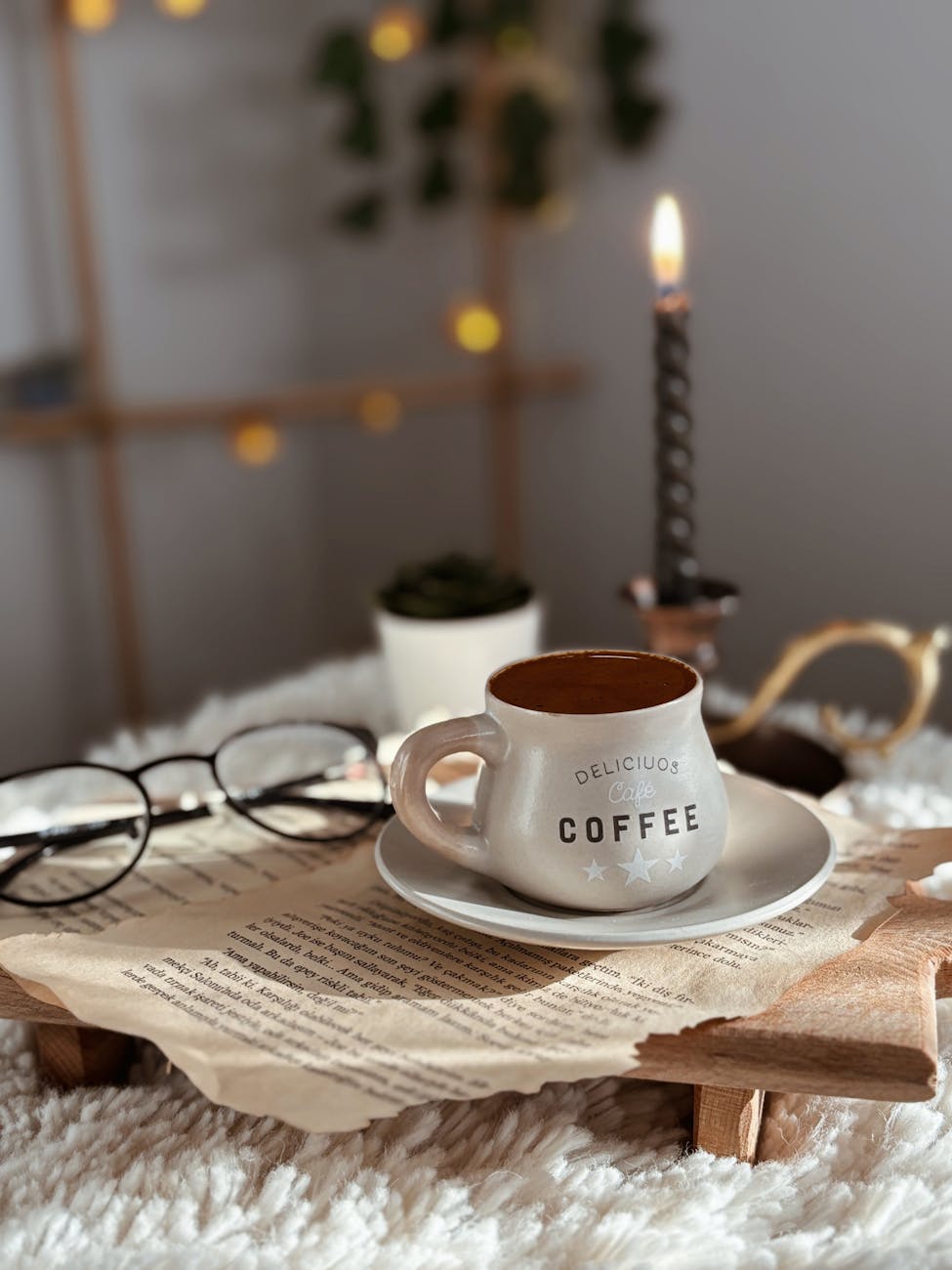 cozy coffee scene with candles and book