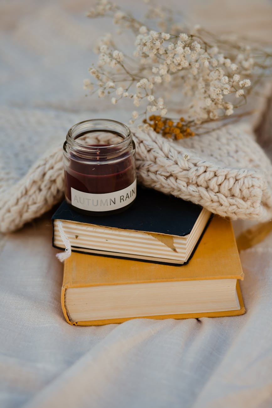 candle on stacked books