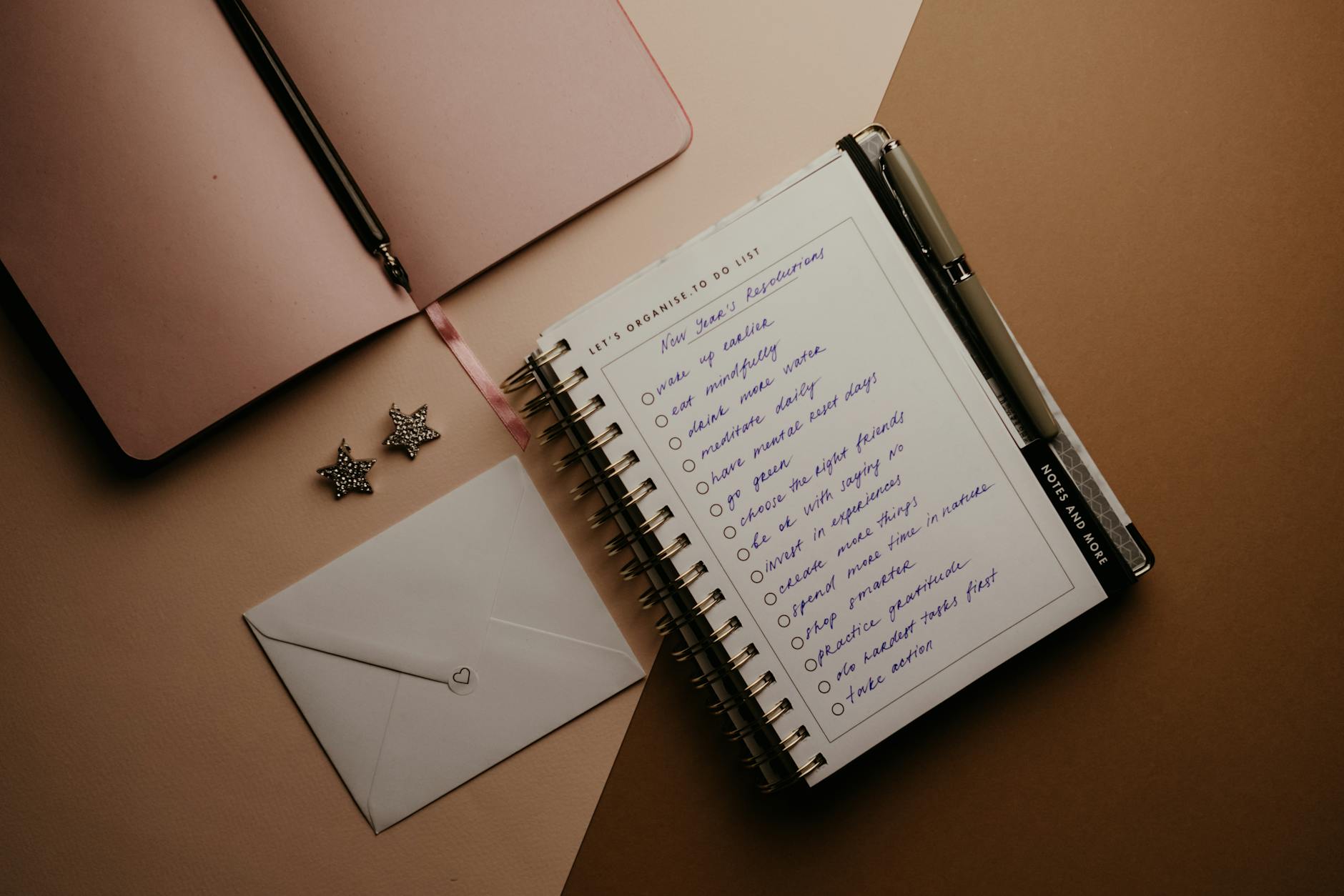 white notebook on brown table