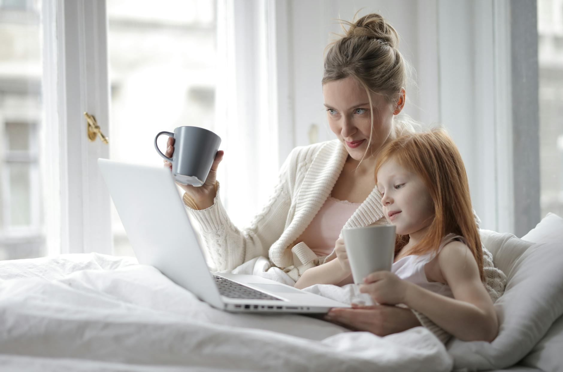 photo of woman holding mug