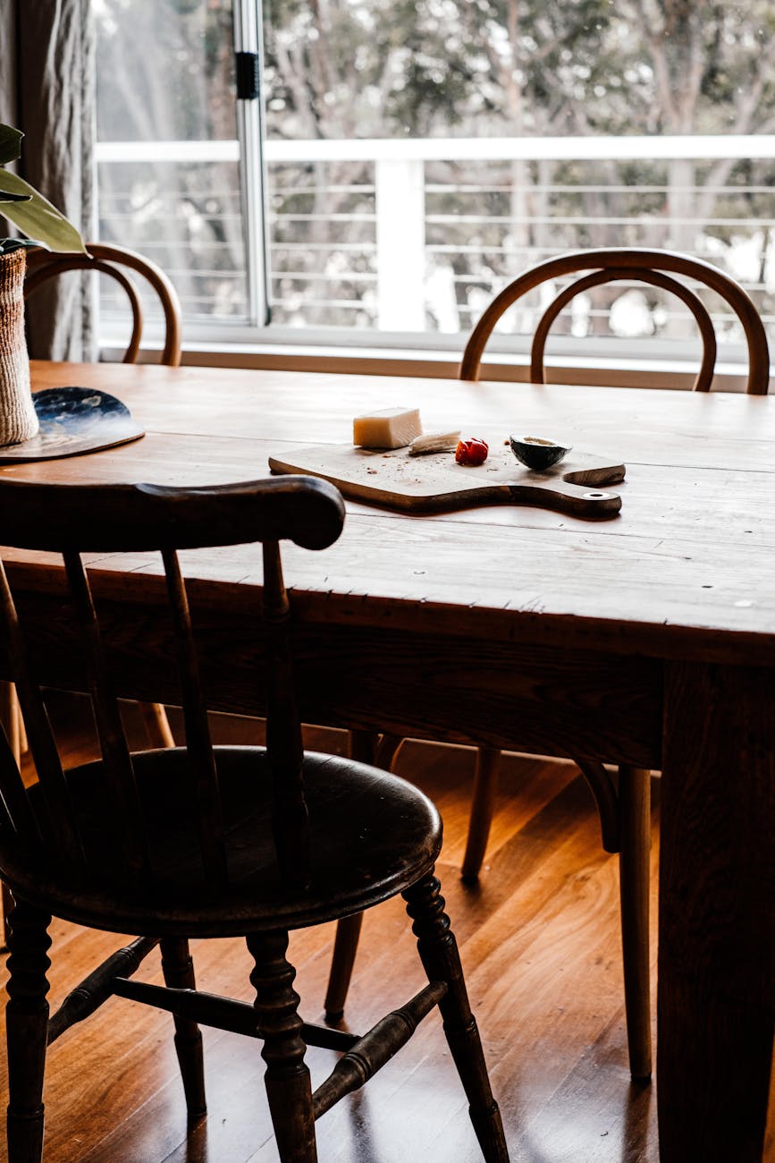 a brown wooden table with chairs
