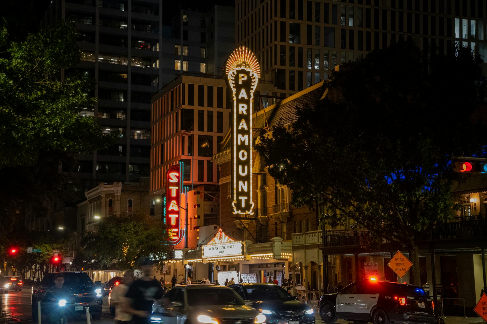 cars on city street near buildings during nighttime