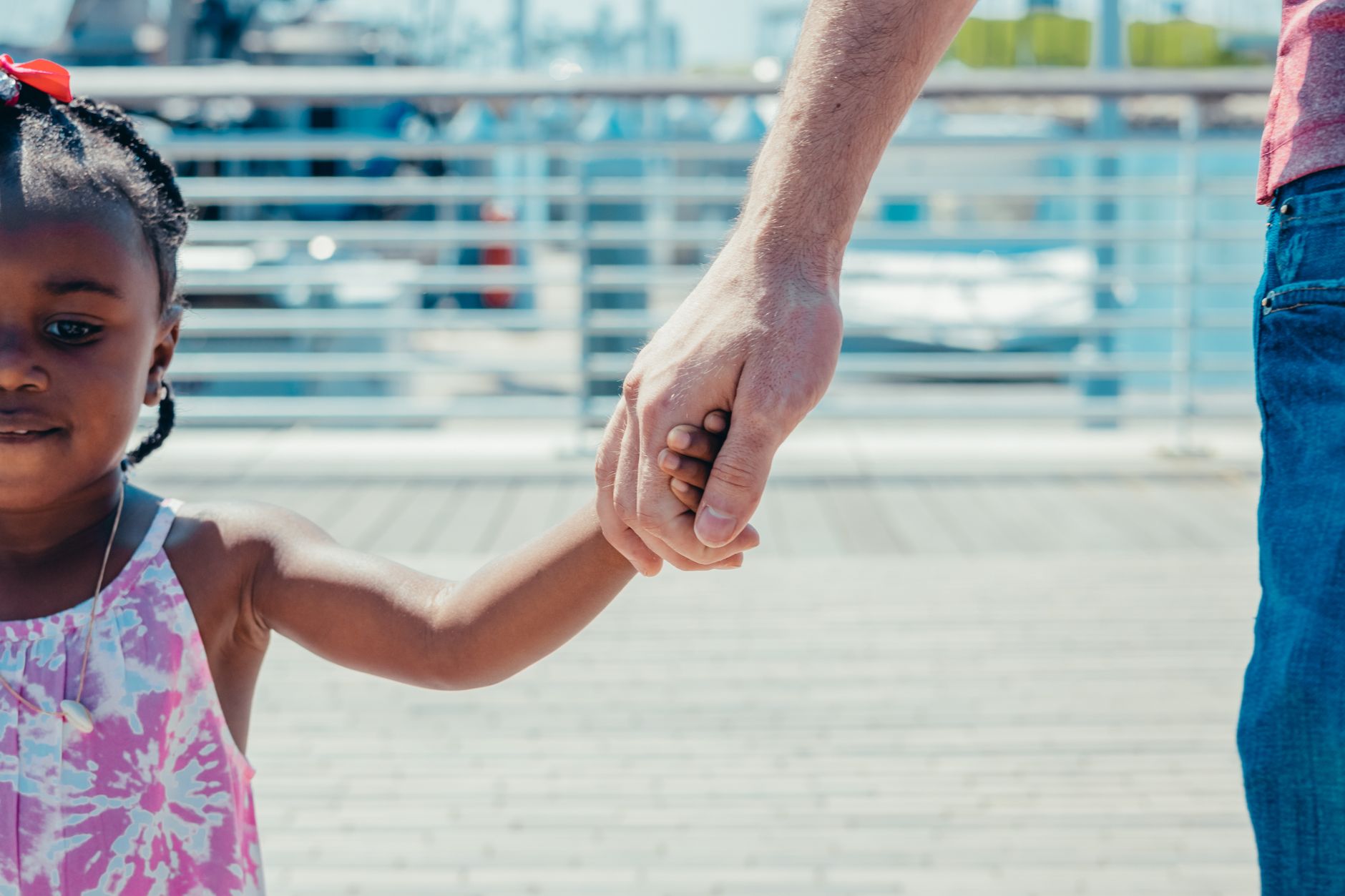 a girl holding a person s hand