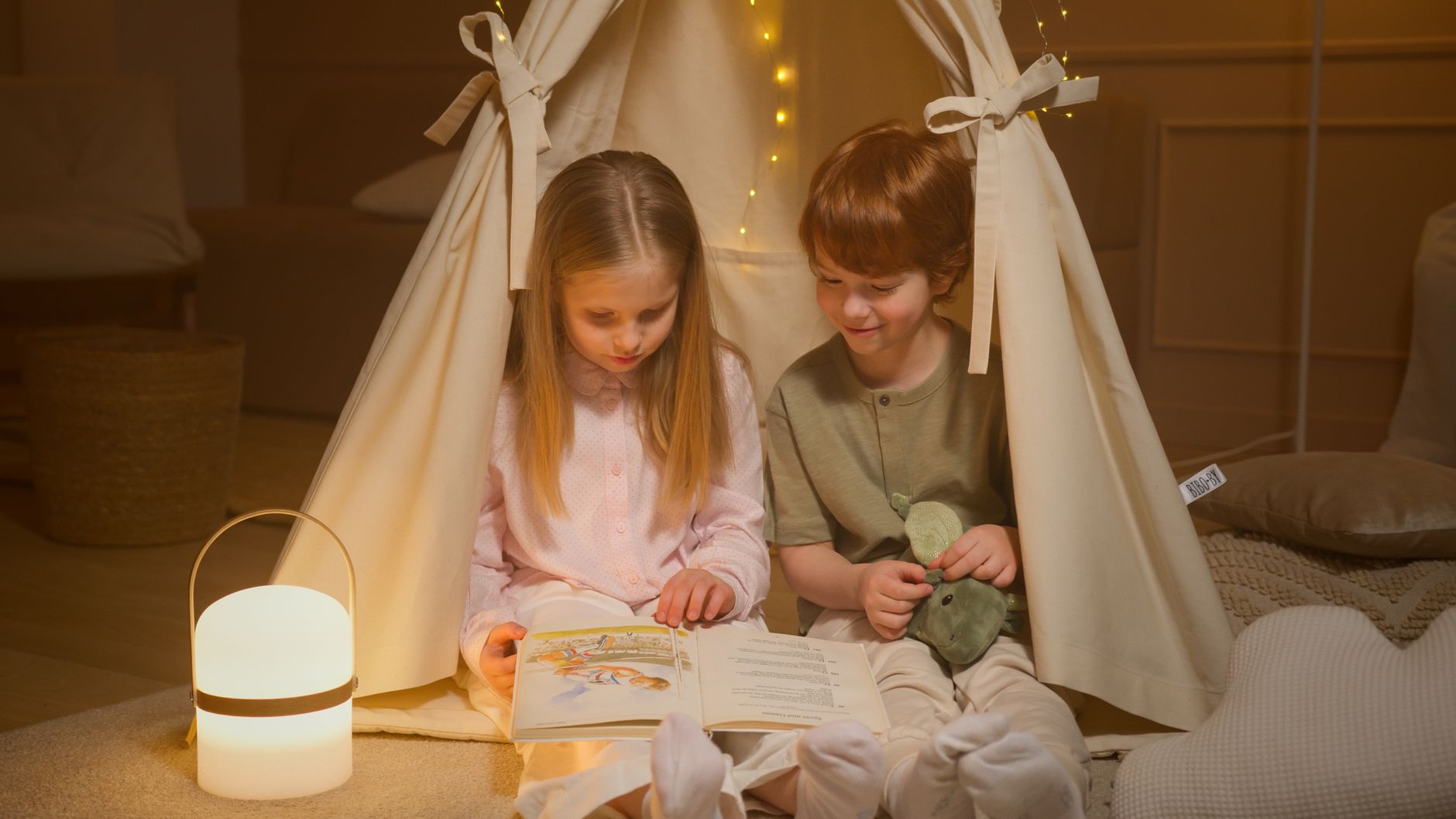 children reading a book inside a room