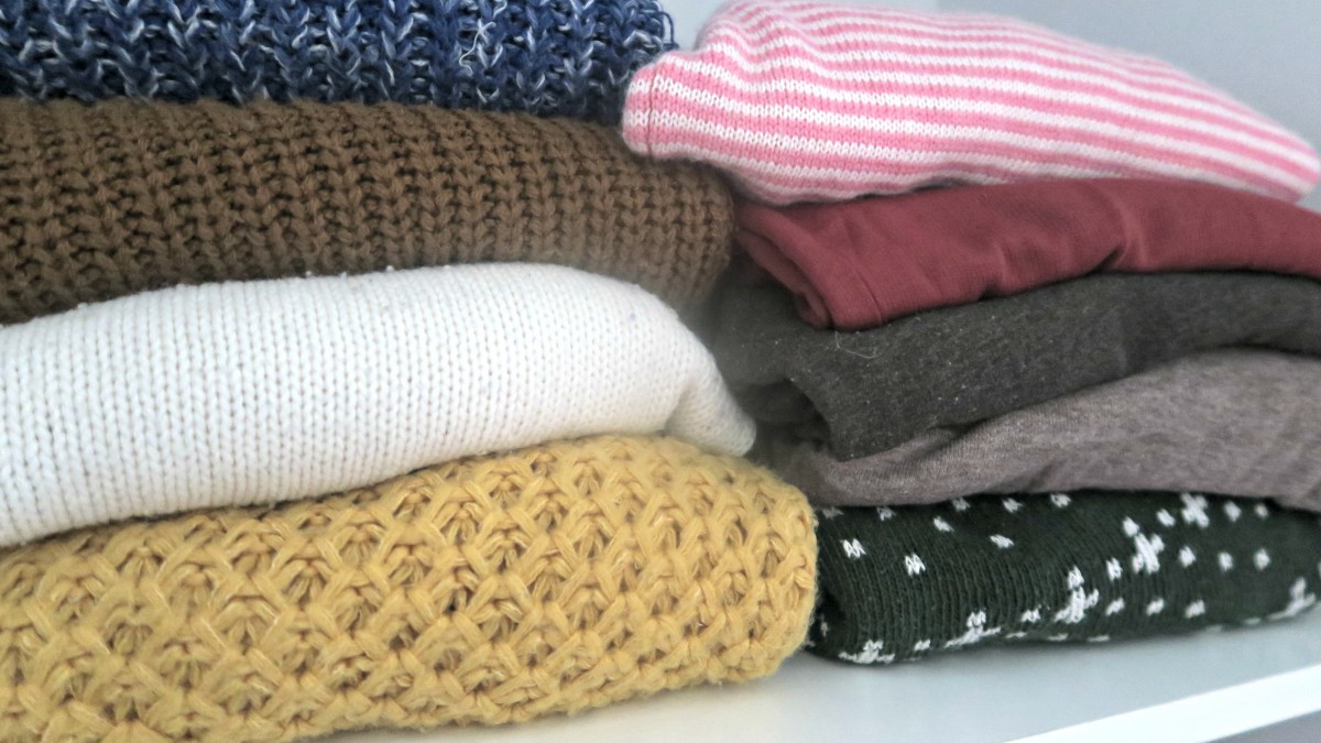 neatly stacked jumpers sweaters