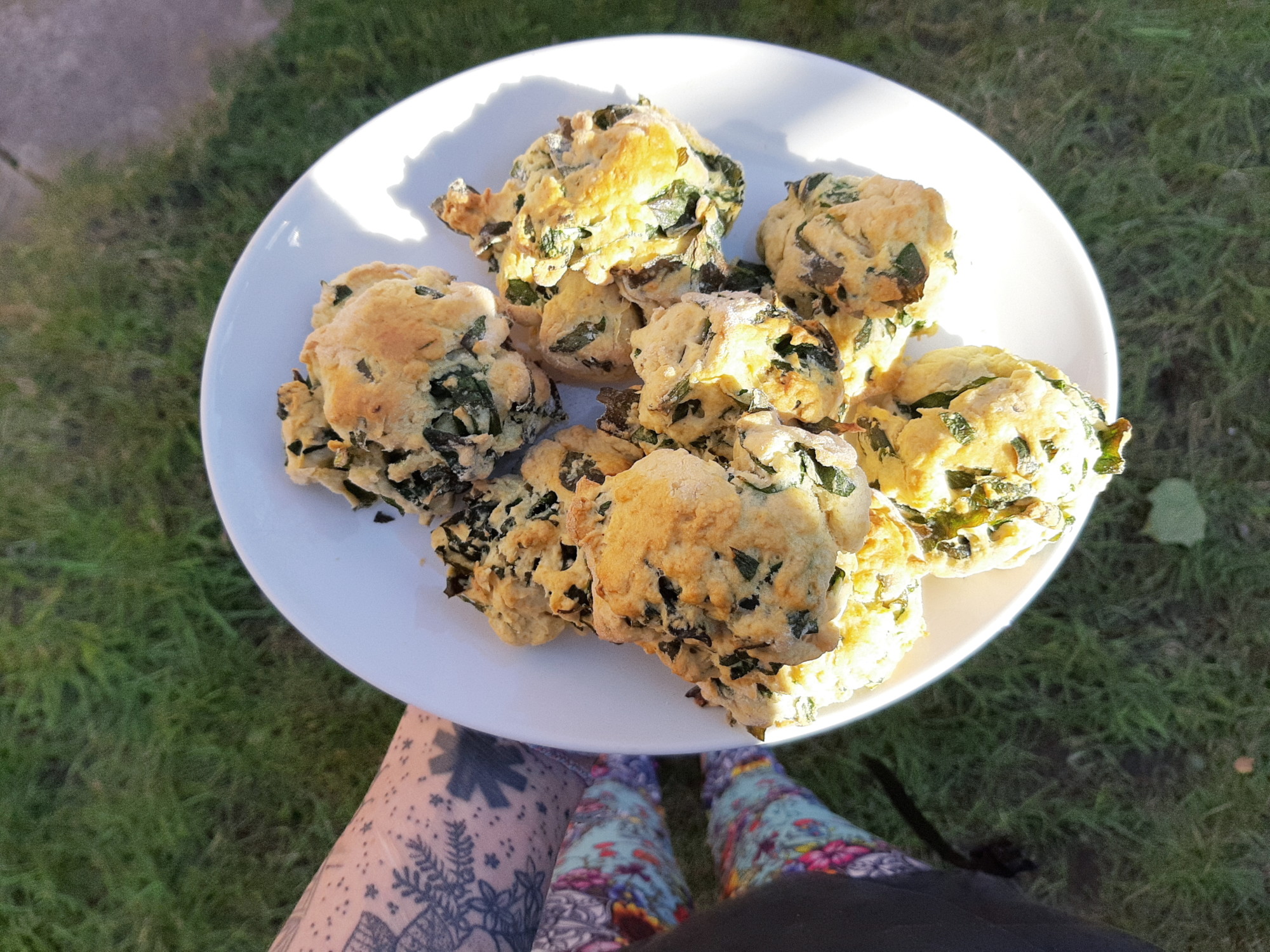 a plate showing freshly baked vegan wild garlic and cheese scones
