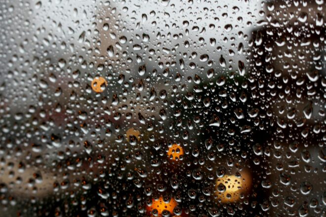 full frame shot of raindrops on glass window