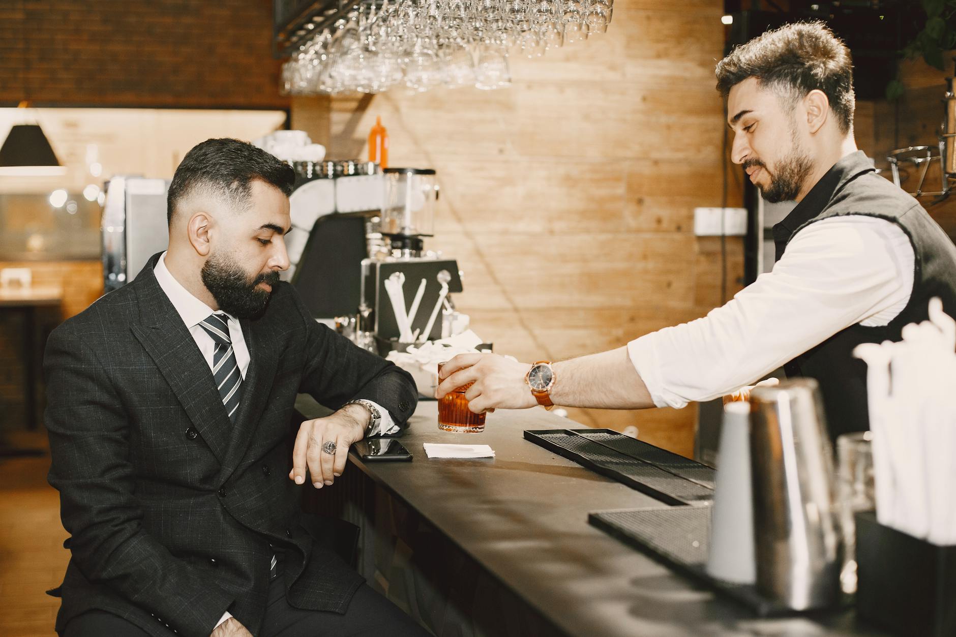 a man holding a glass of wine