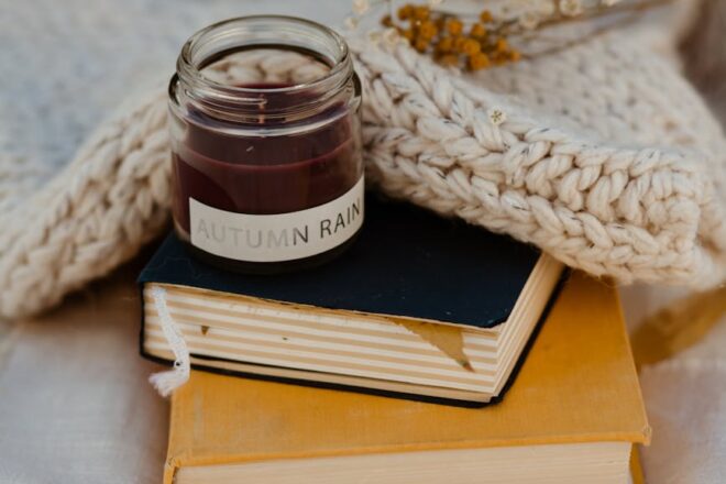 candle on stacked books