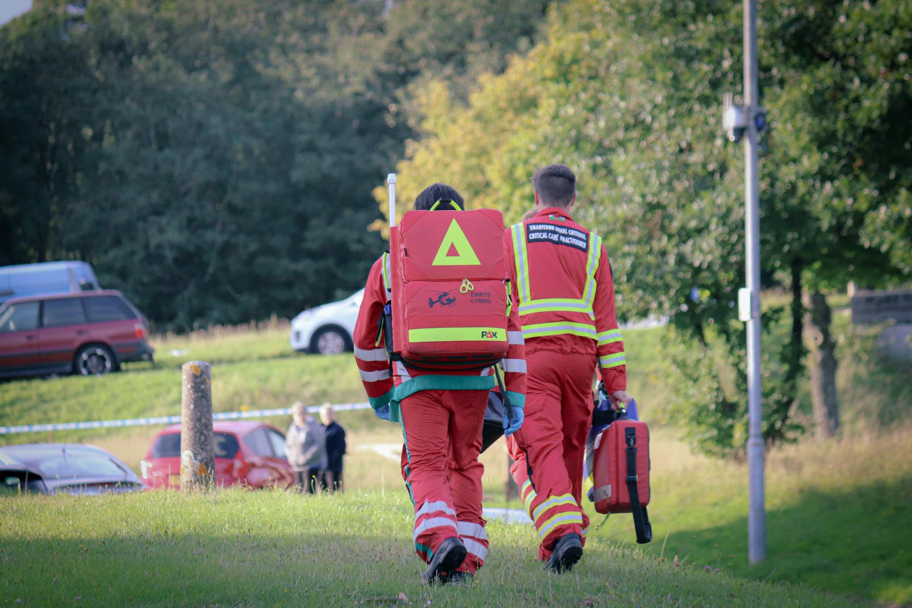 back view of a rescue team on a field